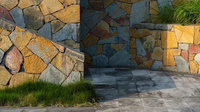 Stone veneer being installed on a home exterior wall