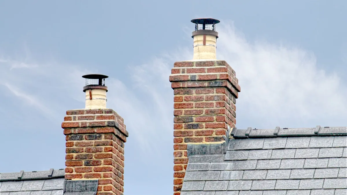 Brick chimney masonry repair on a South Florida rooftop